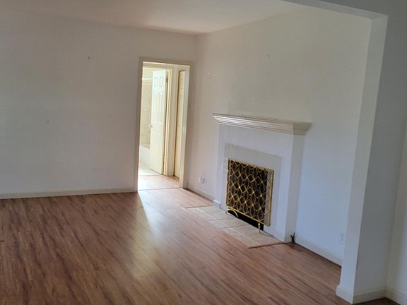 Living Room View to the Hallway and Fireplace