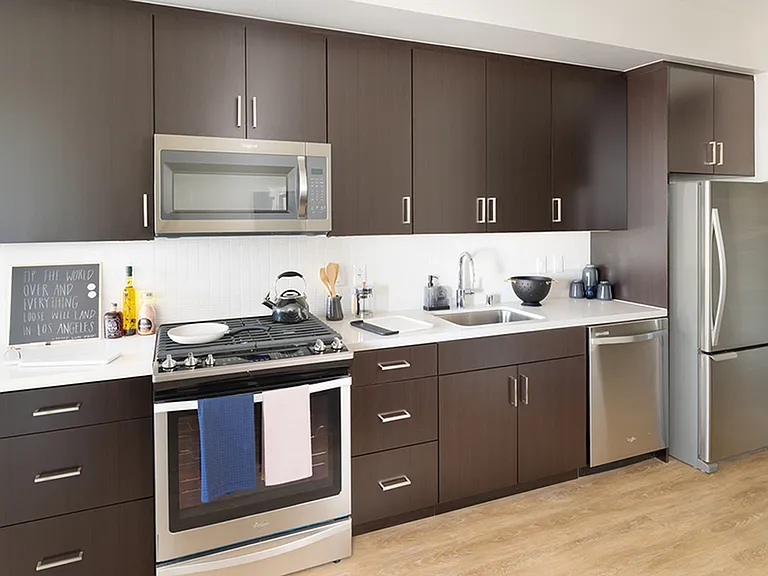 Stunning Kitchens with brown cabinetry and stainless steel appliances