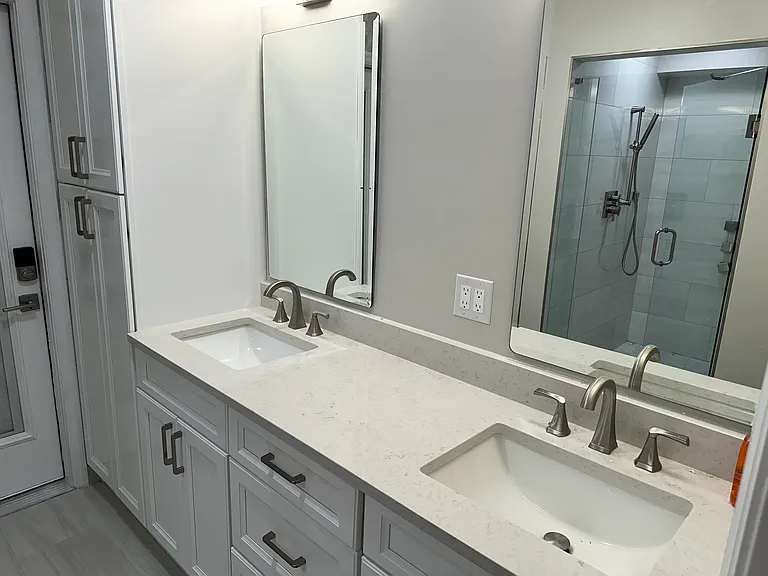 Downstairs bathroom with exit to pool area