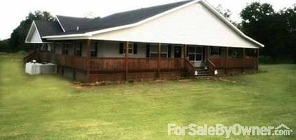View of the house in spring.
						:
						Along the left side of the picture there is a hay meadow that stretches in front