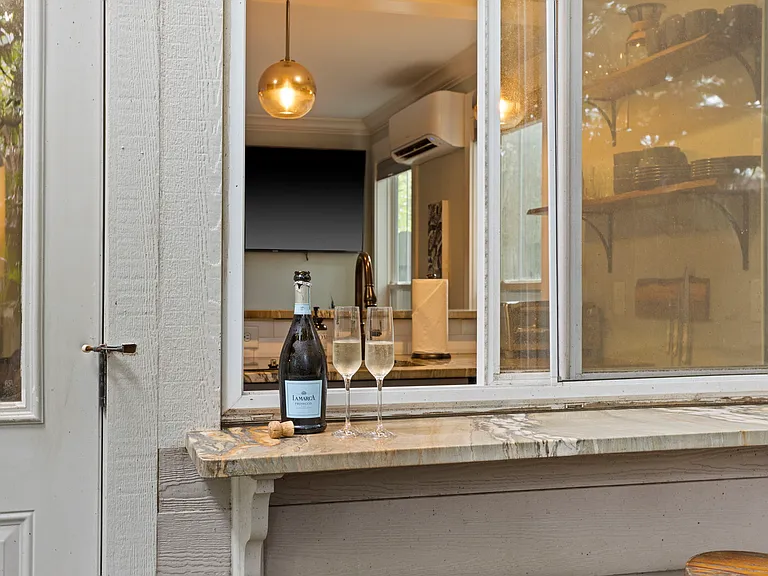 Outdoor Kitchen passthrough window to the patio bar