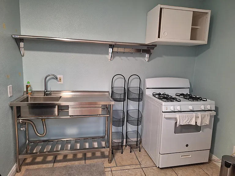 Kitchennette. There is a small fridge outside of view and the kitchen has a wall cabinet outside of view for canned or box goods.