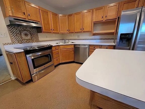 Stainless steel appliances detail this efficent kitchen