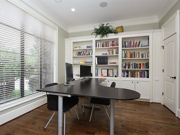 Downstairs Study with double entry doors is equipped with two closets, a possible 5th bedroom.