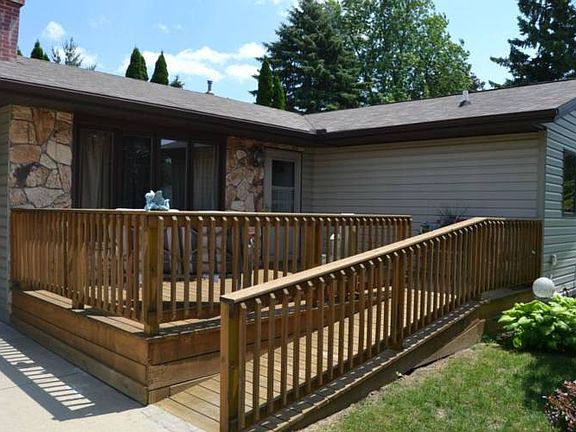 The front entrance has a ramp for easier access.  It leads to the front deck and entrance to the home.
