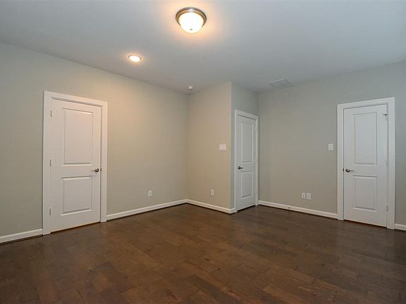 This first floor bedroom has a walk-in closet and access to the En-suite bathroom.