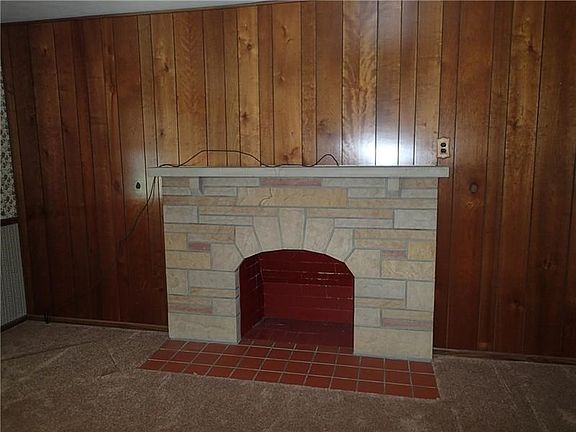 Decorative fireplace in the living room, I can just see the Christmas stockings hanging here!
