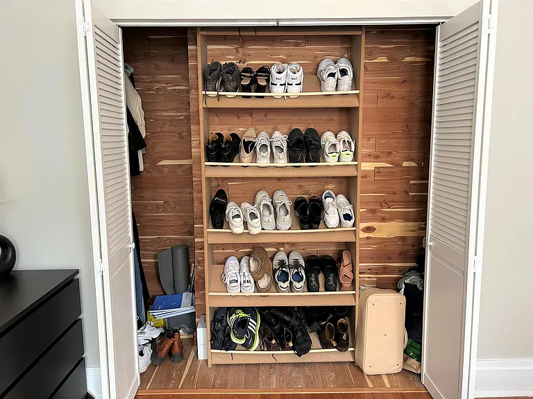 Large bedroom closet with built in shoe holder and so much space