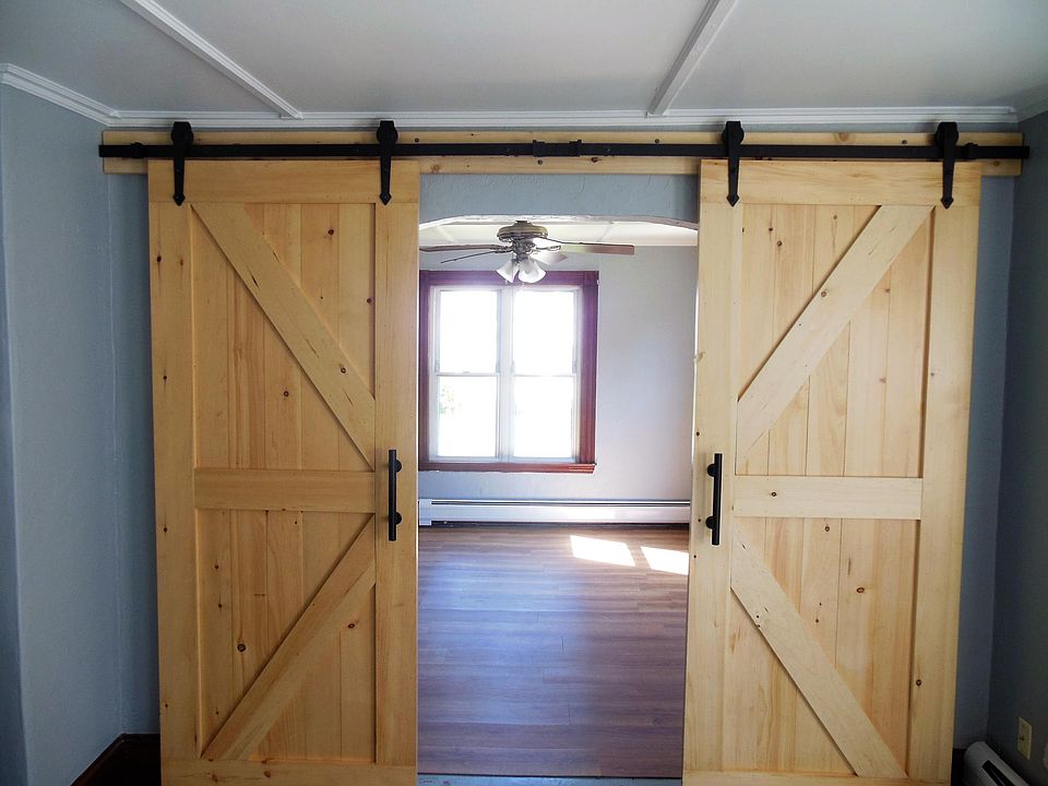 Barn door separating the living room and master bedroom