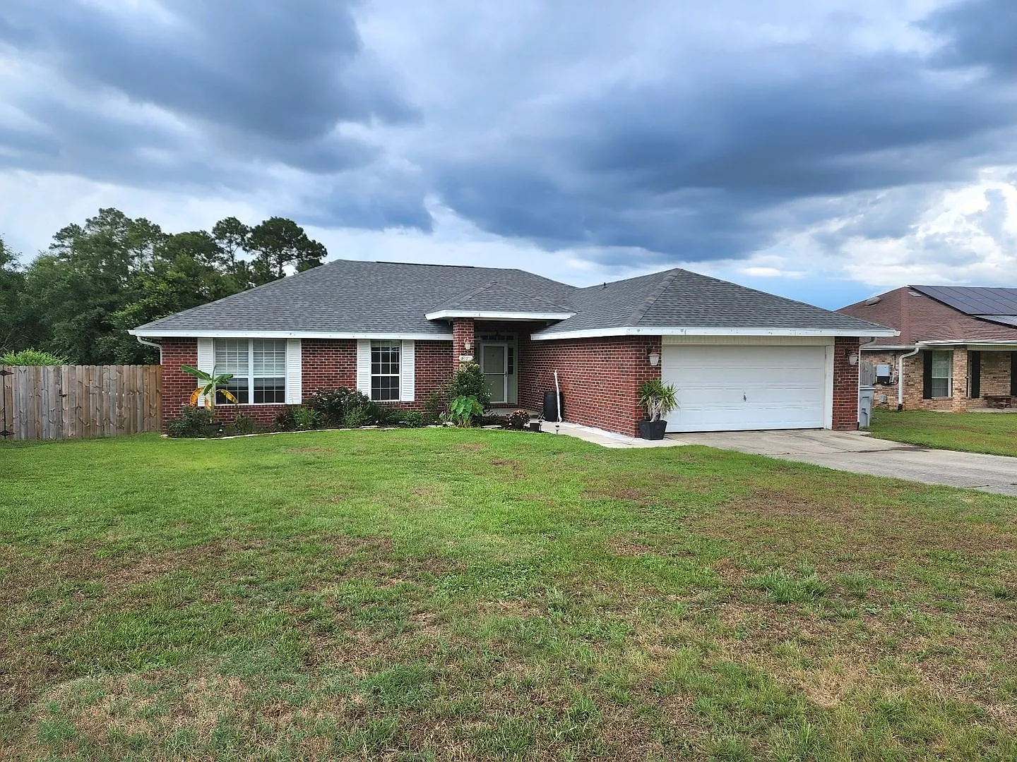 Adorably Styled and Updated 4 bedroom 2 bath Brick home located in Pace Community of La Floresta! — Photo 2