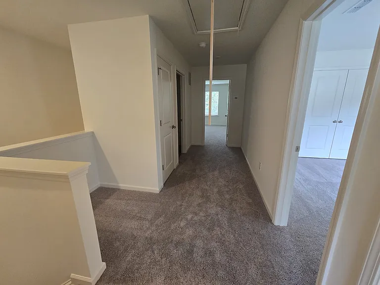 View of the 2nd level, carpeted floor. You can see 'work area' on the left.
