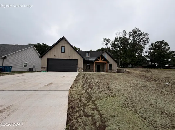 909 N Fountain St, Carterville, MO 64835