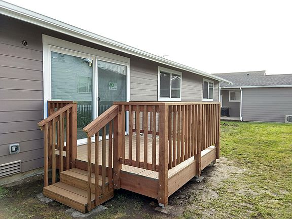 Private backyard deck with no-fuss, never, needs repainting decking.