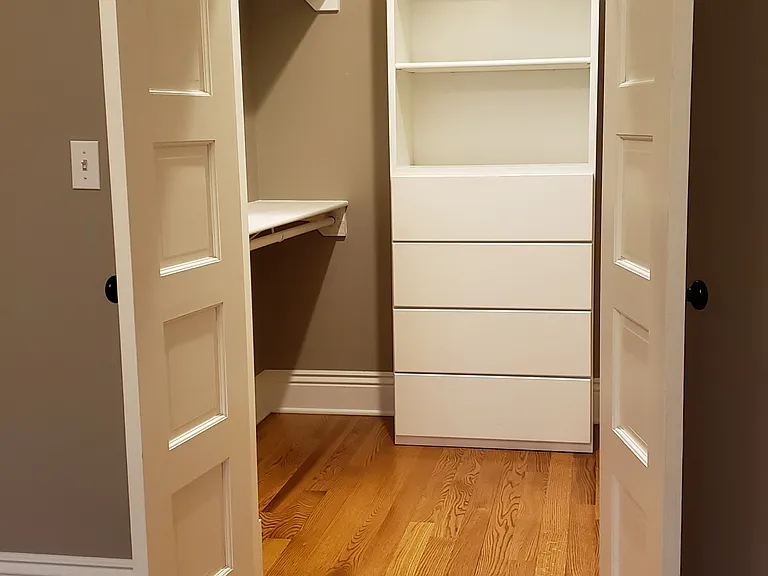 Walk-in closet with French doors.