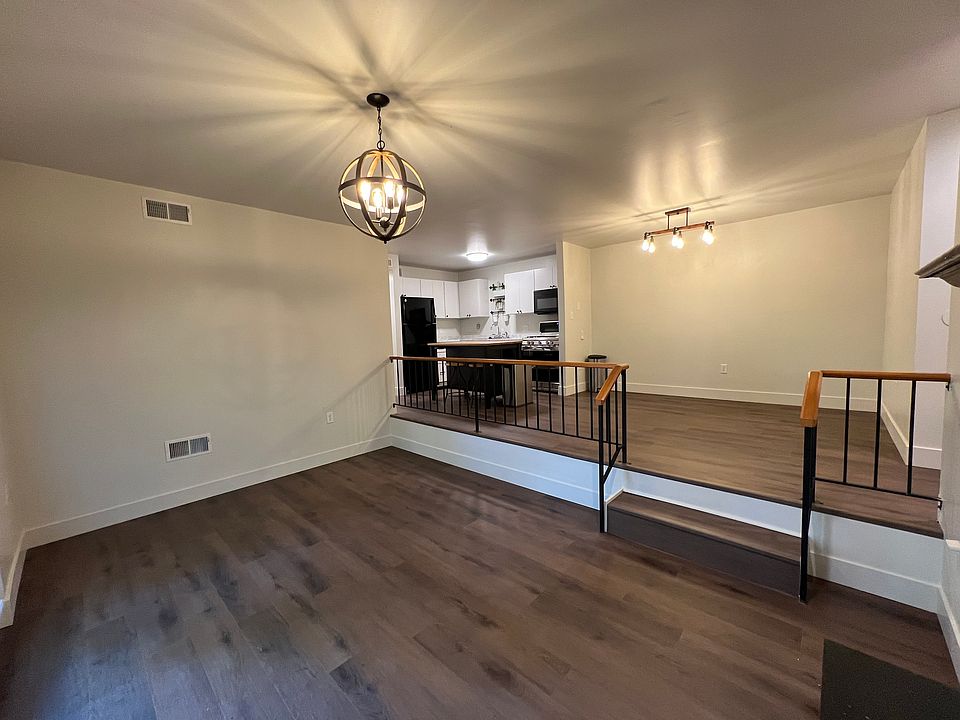 Open concept view from living room into dinning and kitchen.