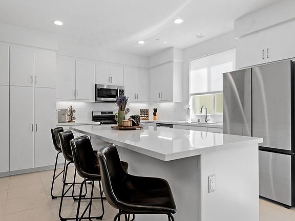 Enjoy a meal from the island with bar-height seating for four.
