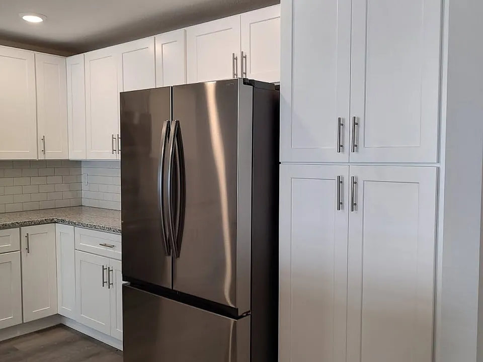 Kitchen with Brand New Stainless Appliances, brand new cabinets, and granite counters.