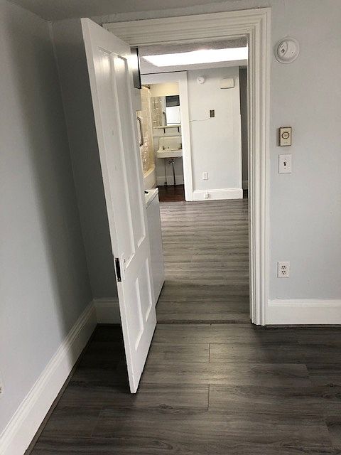 Bedroom looking out to kitchen and bathroom