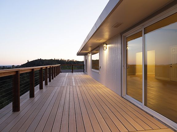 Deck with sliding door off the kitchen and main bedroom.