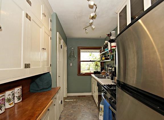 Galley style kitchen with ss/appliances.