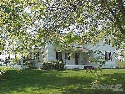 View of front and left side of the home. Notice the covered front and side porches.