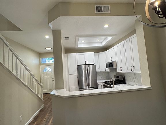 View of kitchen and hallway from the living room