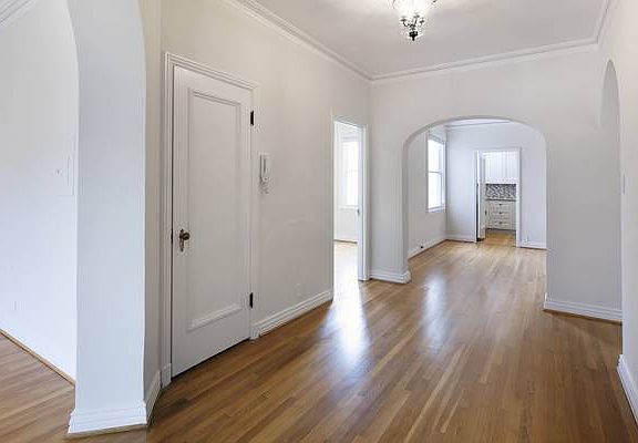 Unit #402 Gracious Foyer with designer lighting fixtures!