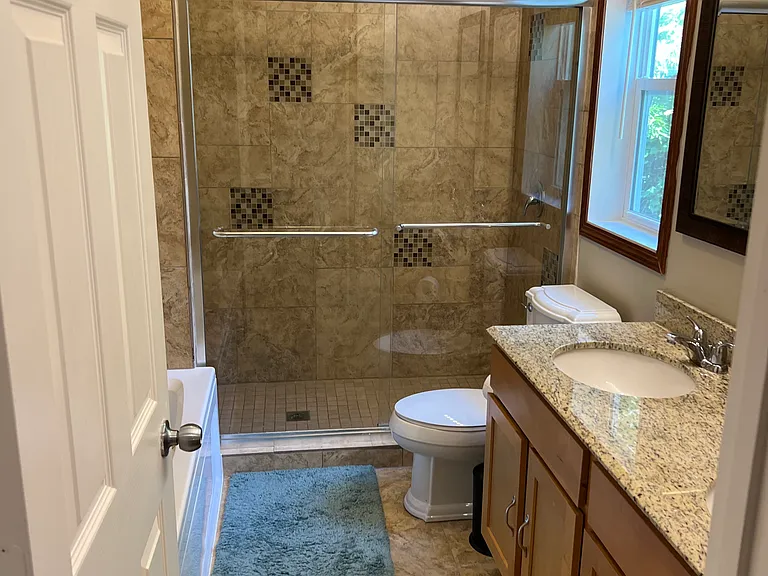 Shared Full Bathroom on 2nd floor with seperate tub and shower and double bowl vanity.