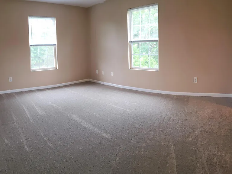 Large master bedroom with tranquil views.