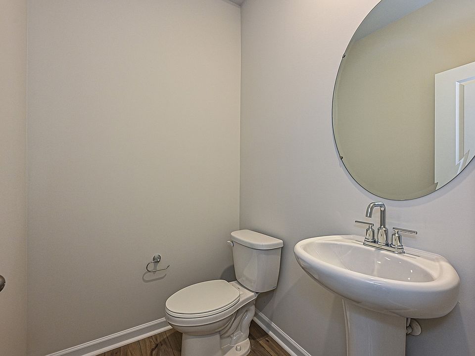 The half bathroom is conveniently located on the first floor for guests.