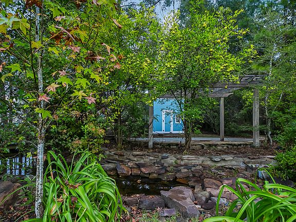 Rear pond and playhouse