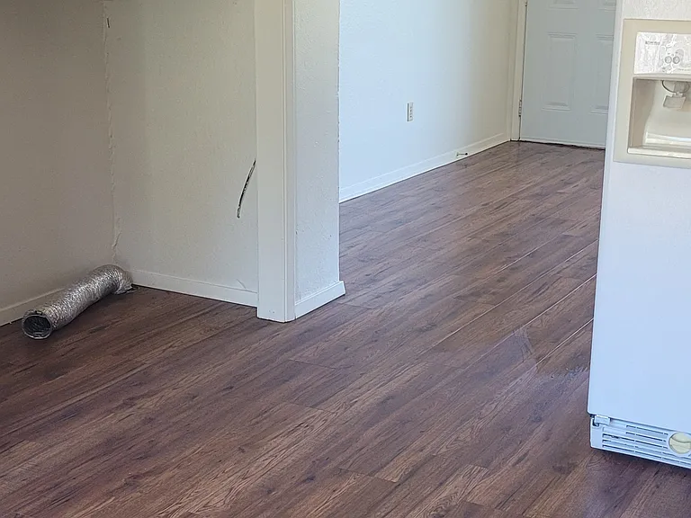 Main room - Kitchen. Washer hook-up area. New.