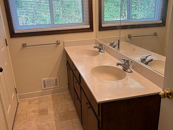 Bath has outside private entry, a door to the left in photo