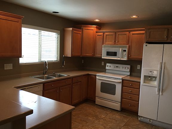 Kitchen: Corian countertops, electric range, microwave hood