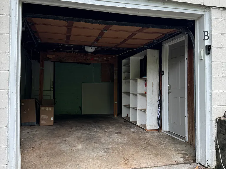 Garage can be used for parking or for extra storage. There is an additional room to the back that can be used for more storage as well.