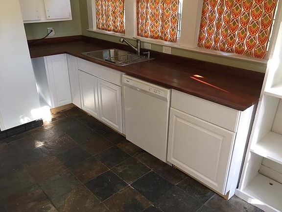 The kitchen with butcher block countertops.
