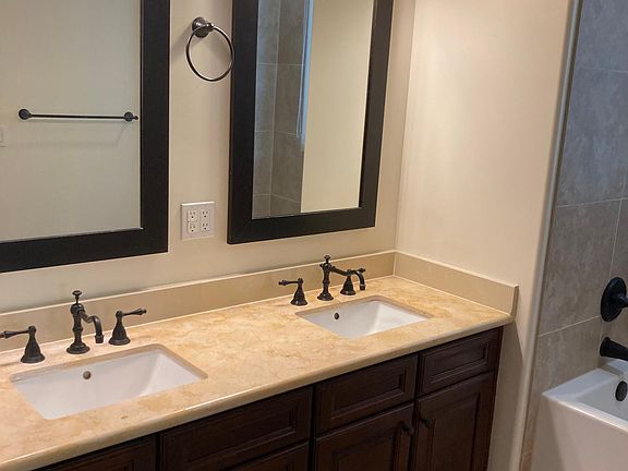 En suite for primary bdrm has dual vanity and soaker tub with separate walk-in shower.