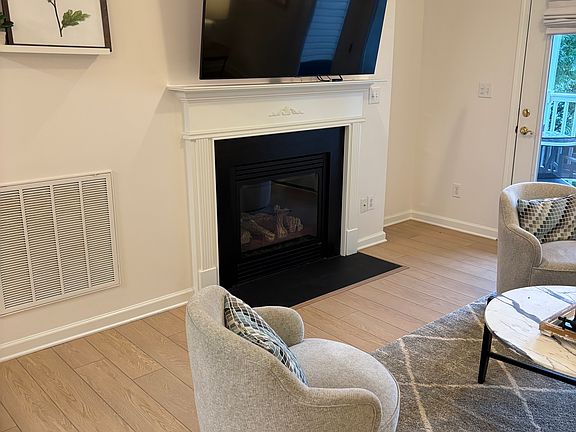 living area - 65" HDTV; gas logs fireplace