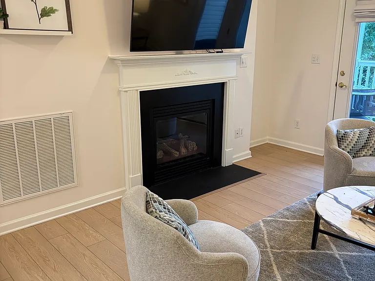 living area - 65" HDTV; gas logs fireplace