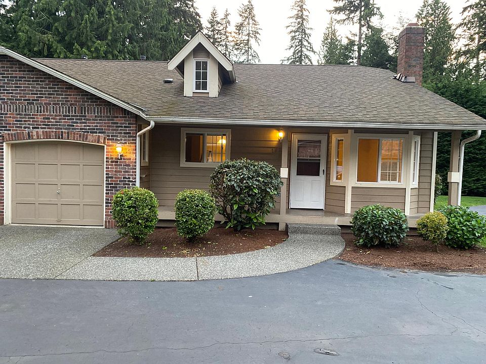 Front of house including clean garage
