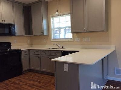 Bar seating area open to main living area.