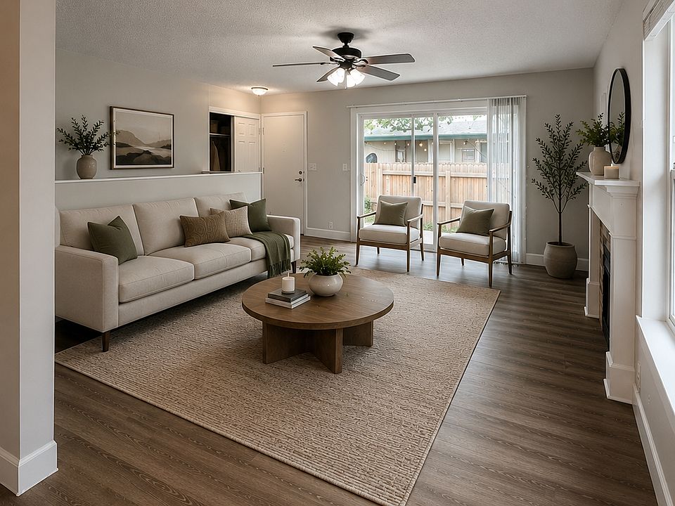 Main Family Room. Large slider next to front door allows for a lot of natural light and airflow off of the private, fenced in outside area