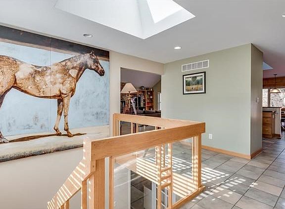 Entry Foyer...Bright and Open.  The skylight above and abundance of windows allow sunlight to stream in.