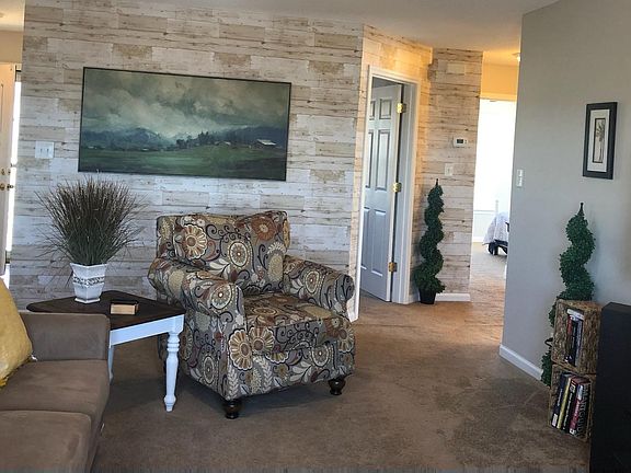 Living room with hall closet, ceiling fan