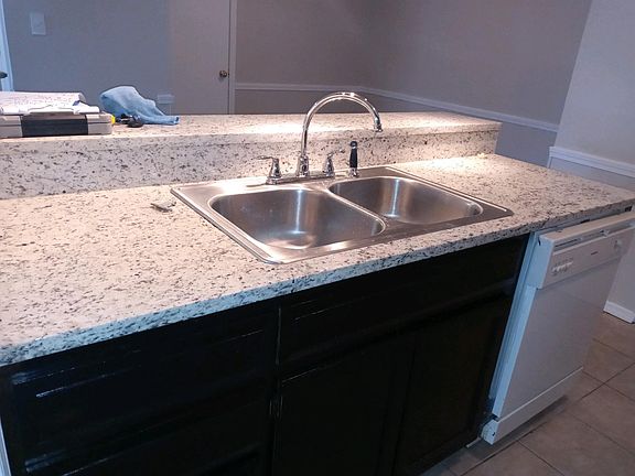 Kitchen sink with new granite counter tops
