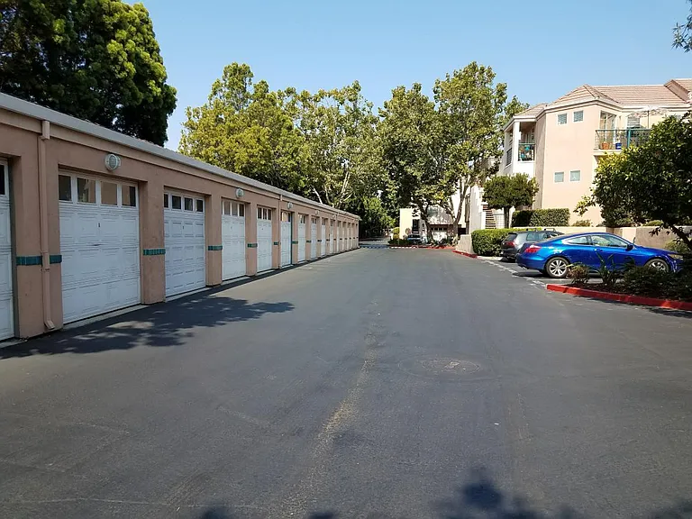Detached garages and guest parking. One assigned detached garage.