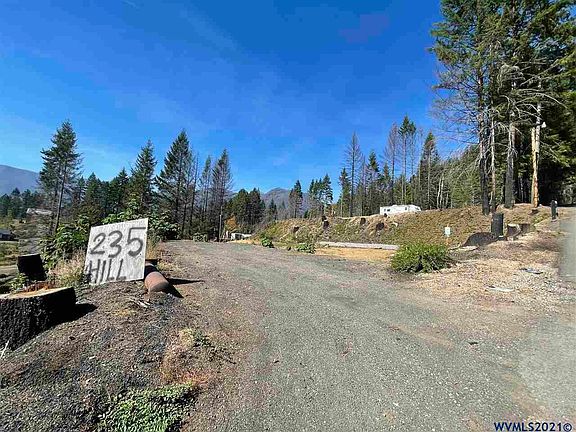 Paved road up to a flat lot ready for you to build or place your RV