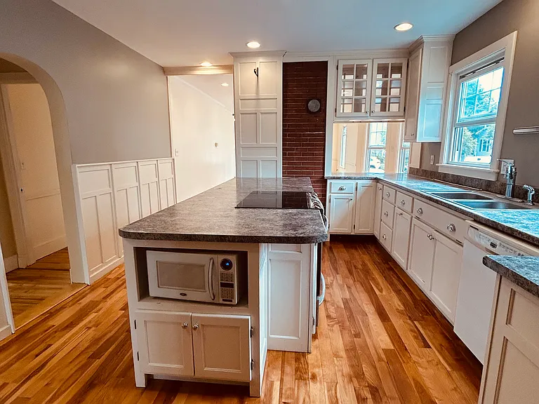 Kitchen. Hallway to bedrooms and bathroom on left.