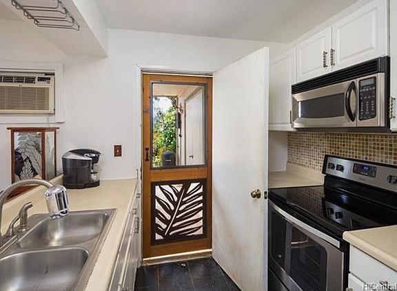 It's so nice to have a back door in the kitchen right off the spacious patio. Makes entertaining easy when BBQing with friends and family. Brand new stainless steel range/stove and dishwasher.