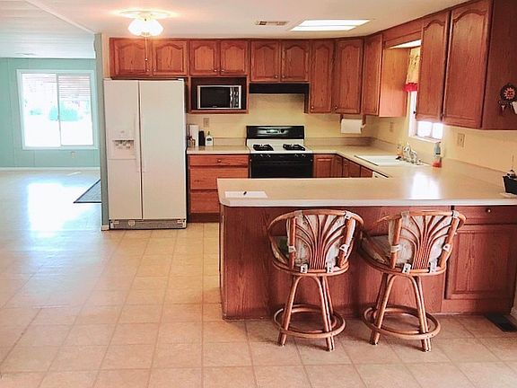 Open-concept kitchen/dining.